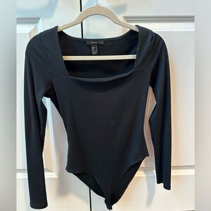 Square neck black long sleeve bodysuit.